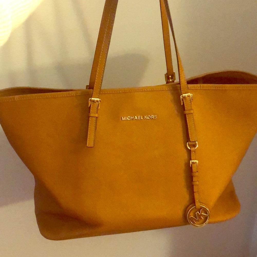 Used MK bag (3 yrs). Light pen on interior of bag.